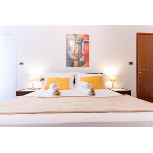 A soli 190m dal Mare Residenza Esclusiva con 2 Suite, 2 Bagni, Balcone con Vista e Area Fitness nel Cuore della Città