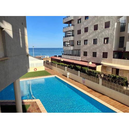 Apartment on the beach with parking and pool