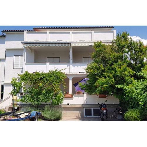 Apartments with parking spaces Barbat, Rab - 23180