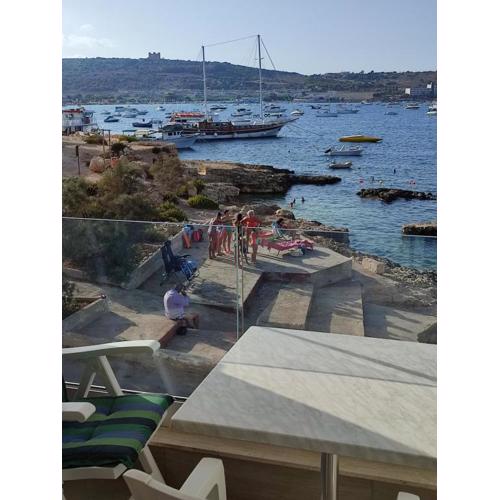 BEACHFRONT with Seaviews Apartment No56 Award Winner Unbeatable Location for Closeness to the Sea Ideal for Guests looking for Winter Spring and Autumn Breaks in Sunny Malta Also Ideal for Coastal Hikers