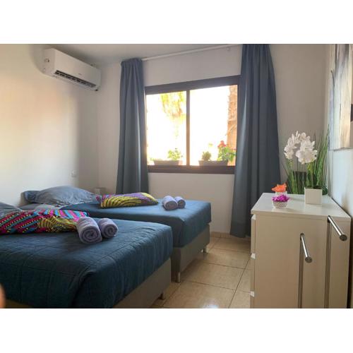 Bedroom with shared bathroom and swimming pool