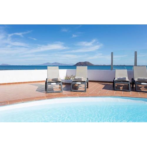 Corralejo Beachfront Villa Remos with Lobos Island View, Private Pool, Wifi & BBQ by Amazzzing Travel