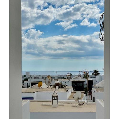 Cozy and sunny apartment over the rooftops