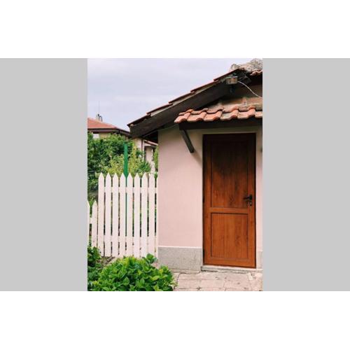 Cute Little House with a White Picket Fence