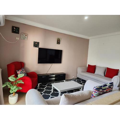Duplex bien equipe securise avec jardin et veranda