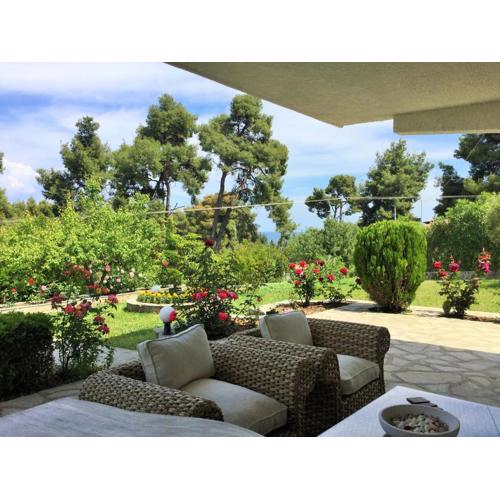 Green, White & Guest Houses by Dimitrios Ballas in Kriopigi, Halkidiki, Greece