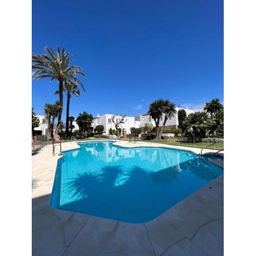 Impeccable large apartment with immense terrace and private garden overlooking the mountain, featuring 2 bedrooms and sleeping up to 4 guests located 100 meters from Plaza Maestranza