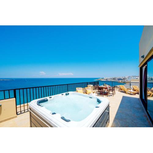 Islet Promenade Seafront Penthouse with breathtaking seaviews and private hot tub on the large terrace by Getawaysmalta