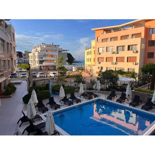 Modern 1BR Apartment with Sea View & Pool Included with Parking Space