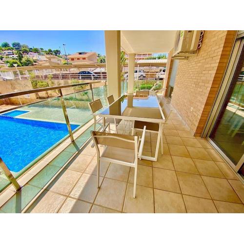 Modern apartment with pool close to the beach.
