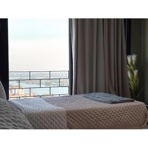 Nile Views from Above 3BR on 22nd Floor in Maadi