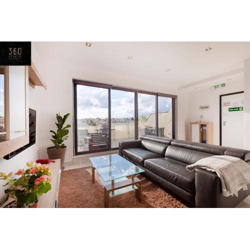 Penthouse and BBQ Kitchen Island & Massive living by 360 Estates