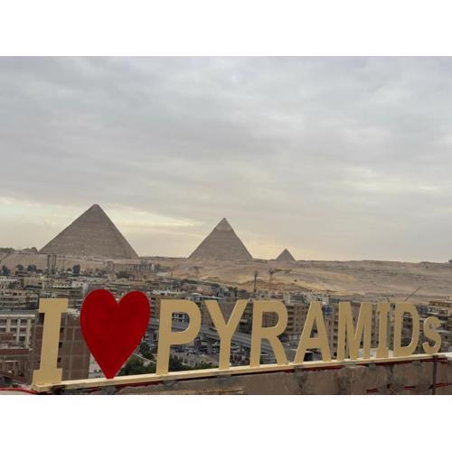 Separate hotel rooms with a view of the pyramids