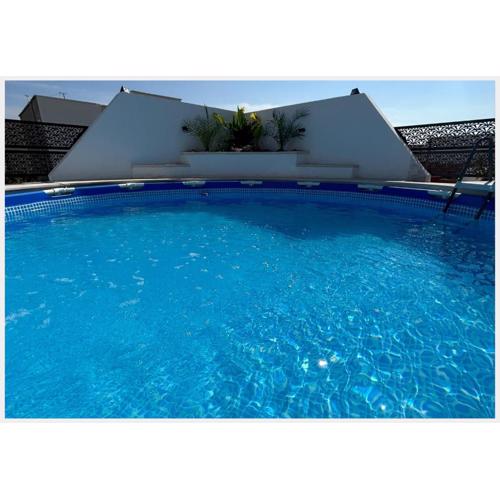Superbe penthouse avec piscine et barbecue