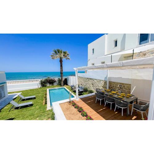 The Sea House beach front villa with pool