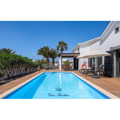Villa Casa Karoline with a sunny terrace, heated pool, comfort and privacy in a quiet neighborhood