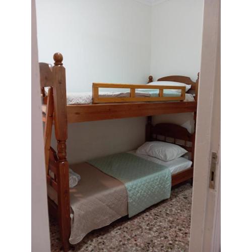 Wooden bunk bed in a dorm 5\