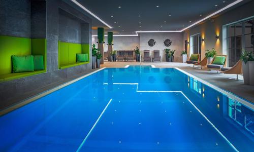 Vysoké Taury 300 m od sjezdovky: Hotel ever.grün KAPRUN **** s polopenzí, wellness a fitness + skibus a sleva